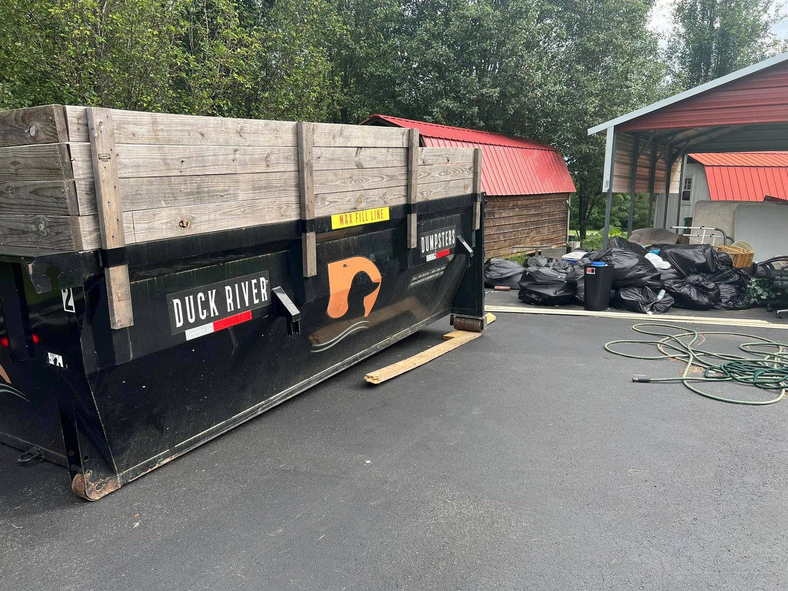 Duck River Dumpsters - Dumpster at job site